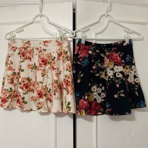 2 skirts, black and white/pink flower skirts
